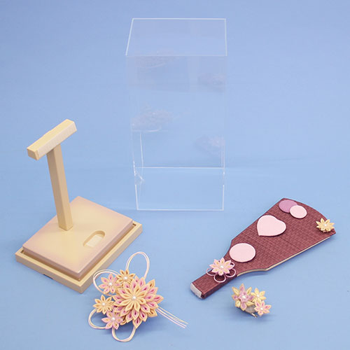 Stylish purple Hagoita sword knob with removable No. 9 hair accessory, in a transparent back case